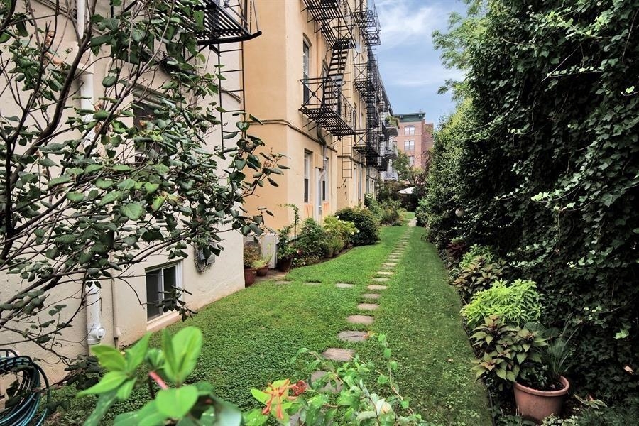 205 14th Street, Unit 4F Hoboken, NJ 07030 - Photo 22 of 22 a view of a back yard of the house