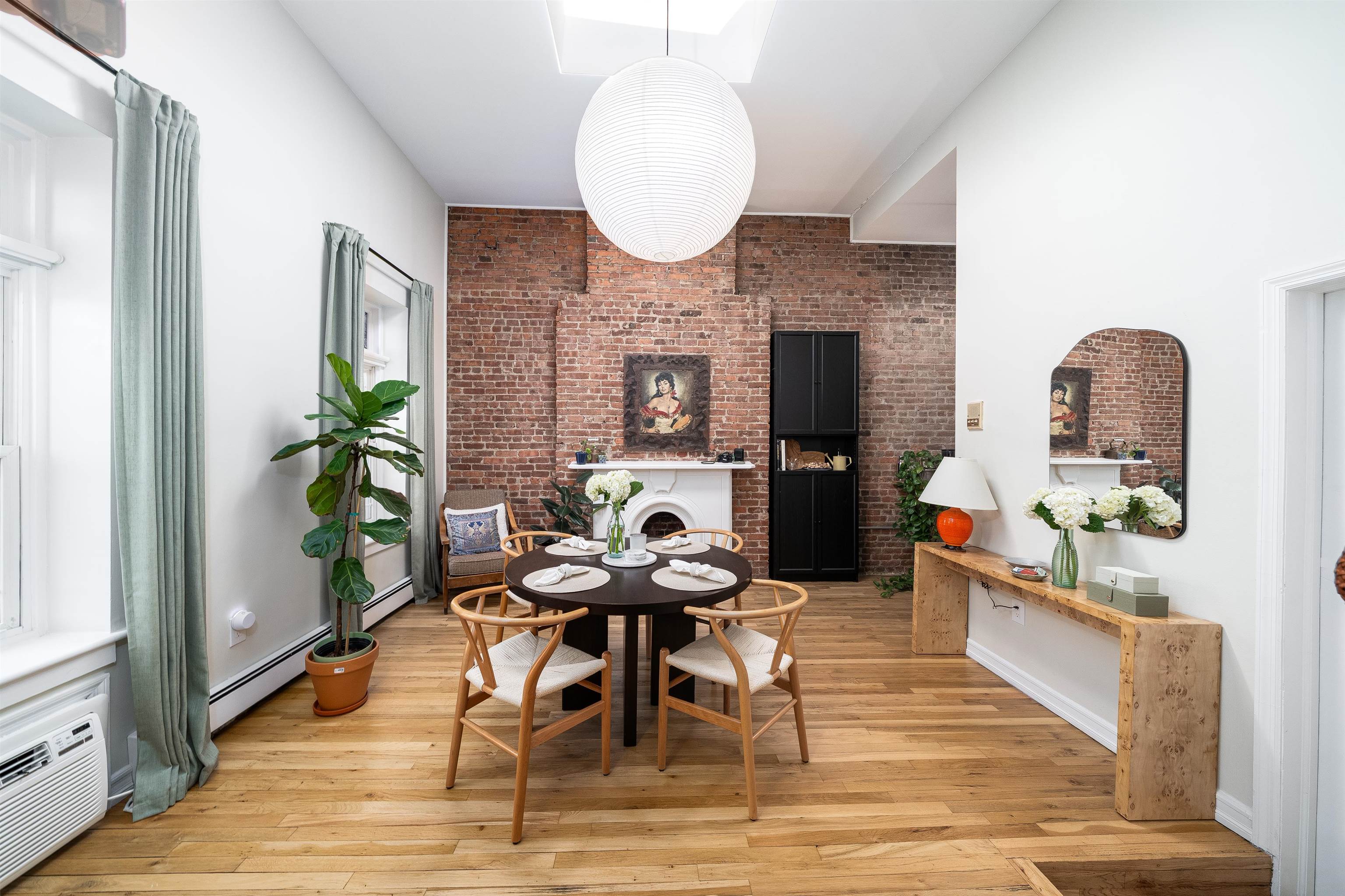 205 14th Street, Unit 4F Hoboken, NJ 07030 - Photo 4 of 22 a living room with fireplace furniture and a potted plant