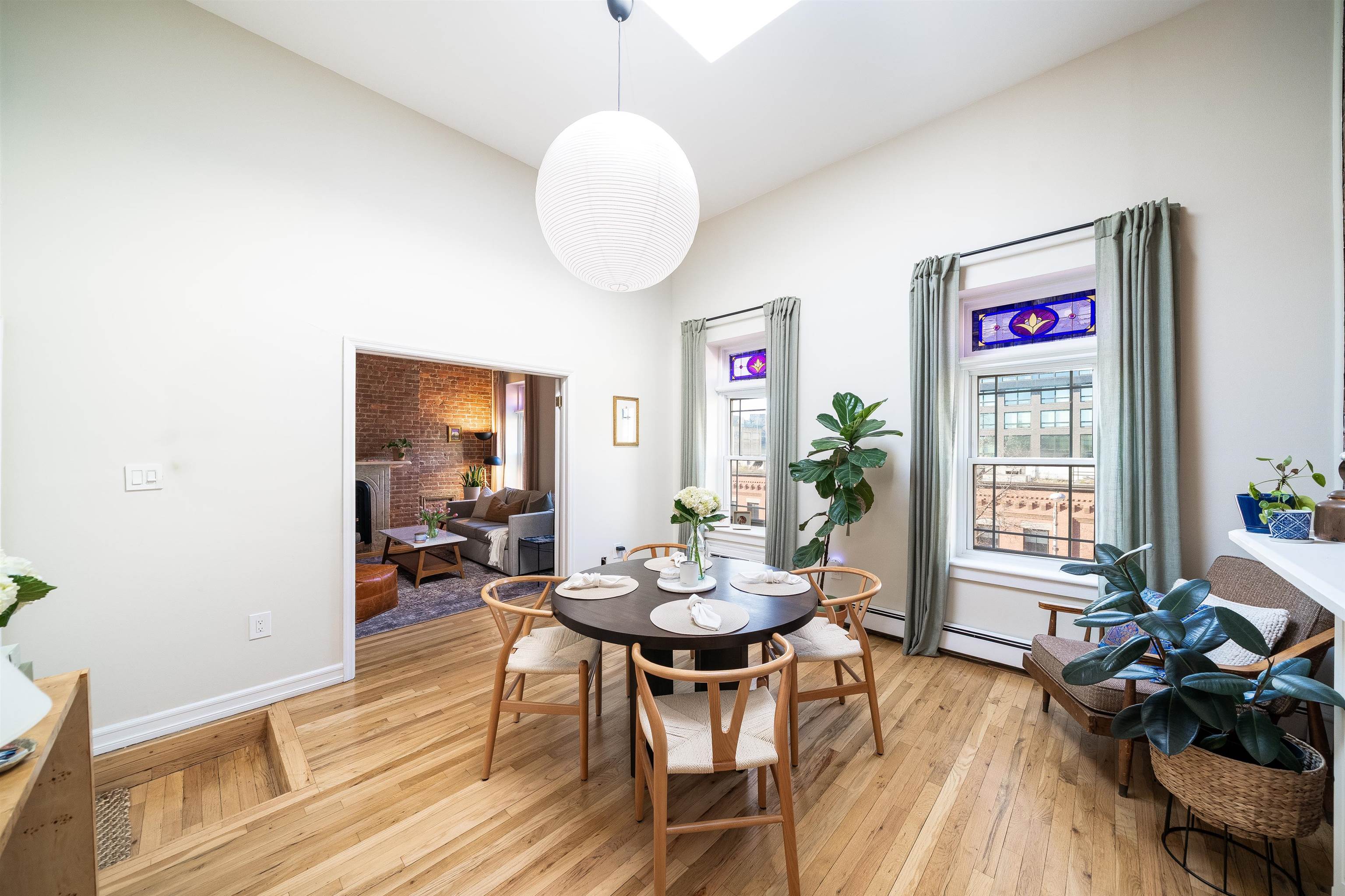 205 14th Street, Unit 4F Hoboken, NJ 07030 - Photo 5 of 22 a view of a dining room with furniture window and wooden floor