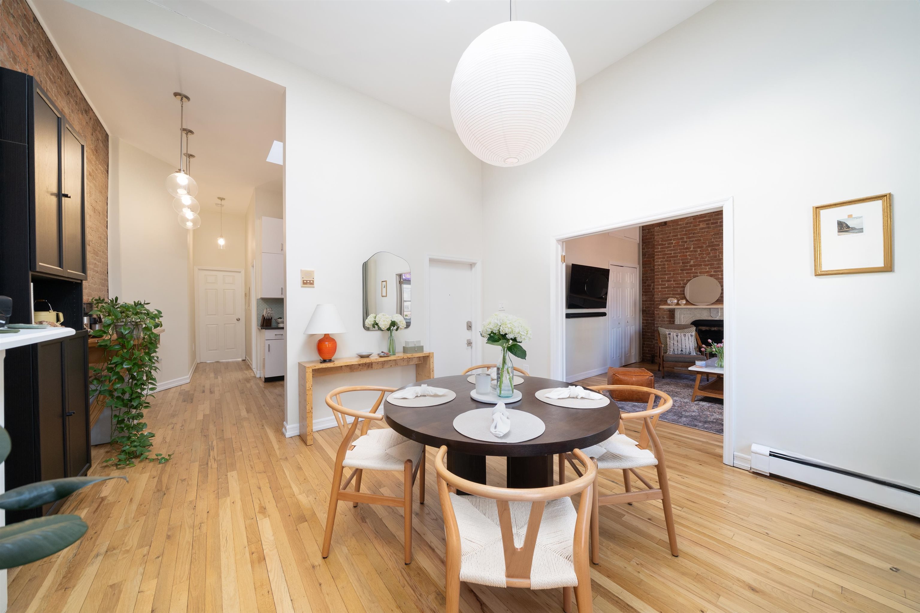 205 14th Street, Unit 4F Hoboken, NJ 07030 - Photo 6 of 22 a view of a dining room with furniture and wooden floor