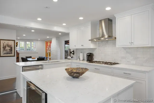 a kitchen with a sink a stove and cabinets