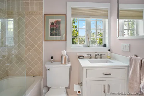 a bathroom with a sink toilet and tub