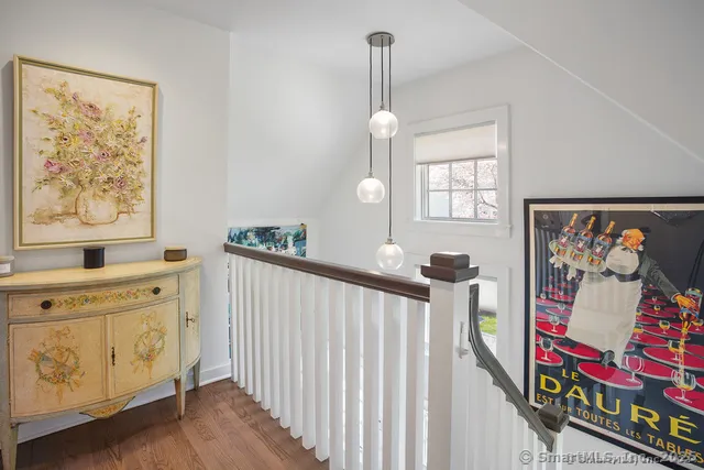 a view of an entryway with wooden floor