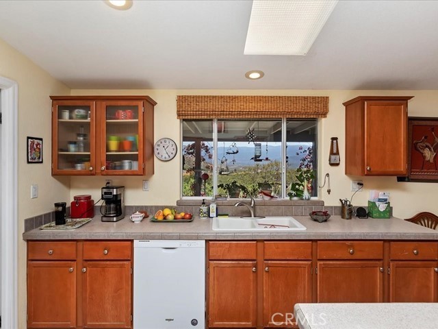 40410 Exa Ely Road Hemet, CA 92544 - Photo 17 of 74 a kitchen with stainless steel appliances kitchen island granite countertop a sink and cabinets