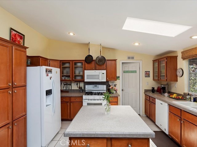 40410 Exa Ely Road Hemet, CA 92544 - Photo 18 of 74 a kitchen with stainless steel appliances a refrigerator and a stove top oven