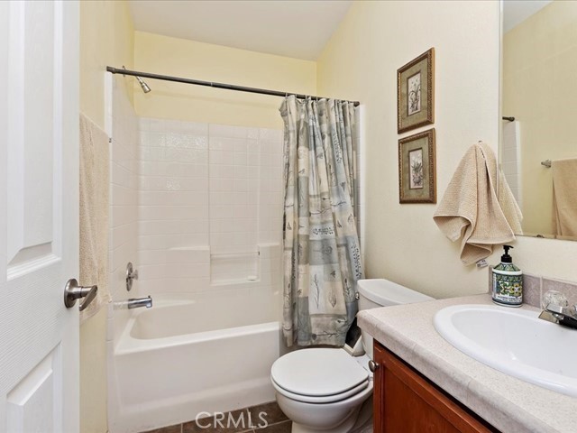 40410 Exa Ely Road Hemet, CA 92544 - Photo 26 of 74 a bathroom with a sink toilet and shower