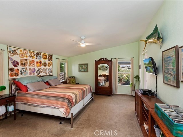 40410 Exa Ely Road Hemet, CA 92544 - Photo 30 of 74 a bedroom with a bed and a dresser next to a window