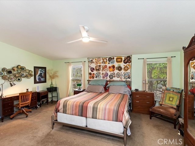 40410 Exa Ely Road Hemet, CA 92544 - Photo 31 of 74 a bedroom with a bed and wooden floor