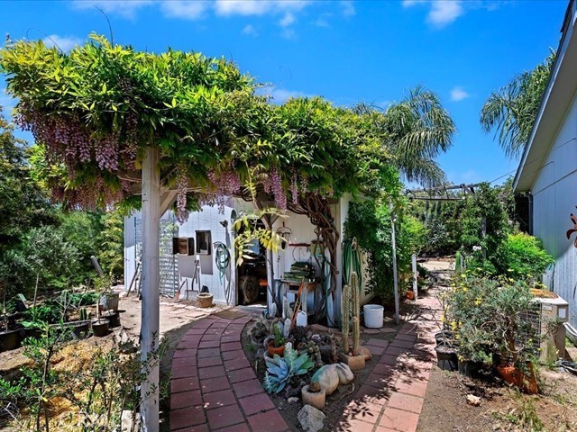 40410 Exa Ely Road Hemet, CA 92544 - Photo 44 of 74 a front view of a house with garden