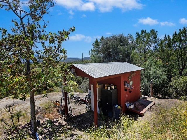 40410 Exa Ely Road Hemet, CA 92544 - Photo 45 of 74 a view of a house with a yard and sitting area