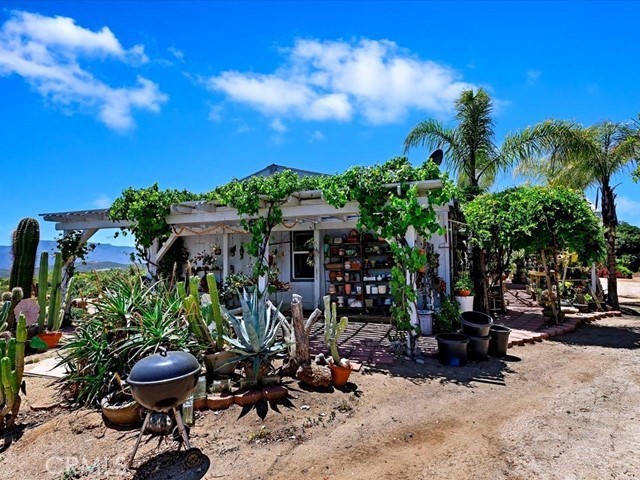 40410 Exa Ely Road Hemet, CA 92544 - Photo 49 of 74 a view of a chairs and table in a backyard