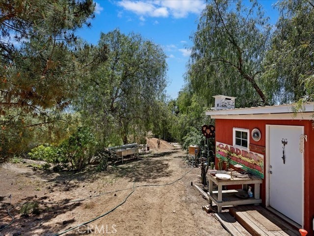 40410 Exa Ely Road Hemet, CA 92544 - Photo 61 of 74 a view of a house with backyard and sitting area