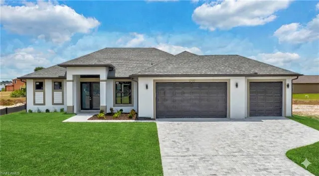 a front view of a house with a garden and plants