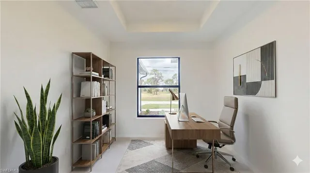 a view of a workspace with furniture and a bookshelf