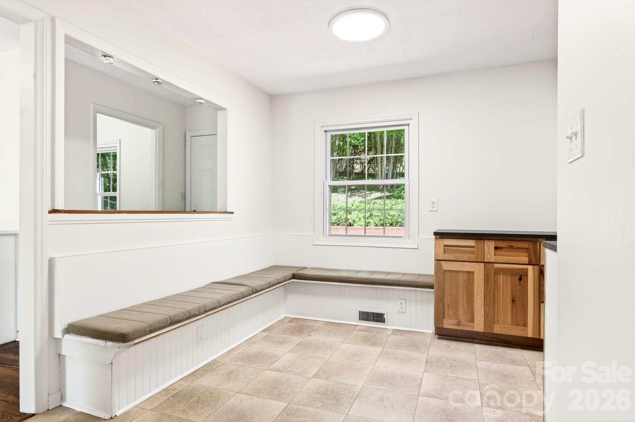 34 Wolfe Cove Road Asheville, NC 28804 - Photo 12 of 42 a view of a kitchen with a tub and a window
