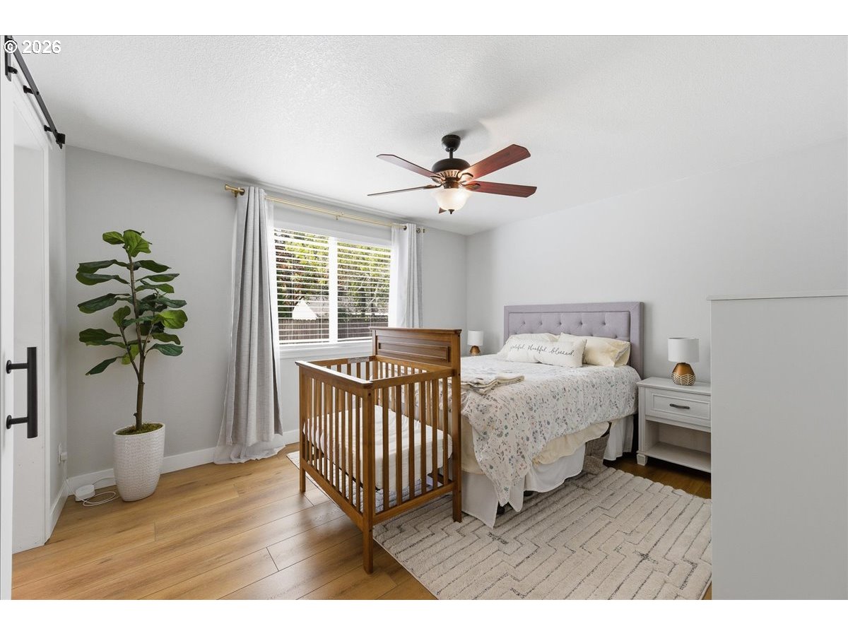 18988 Southwest Pike Lane Beaverton, OR 97078 - Photo 22 of 36 a bedroom with furniture and a window