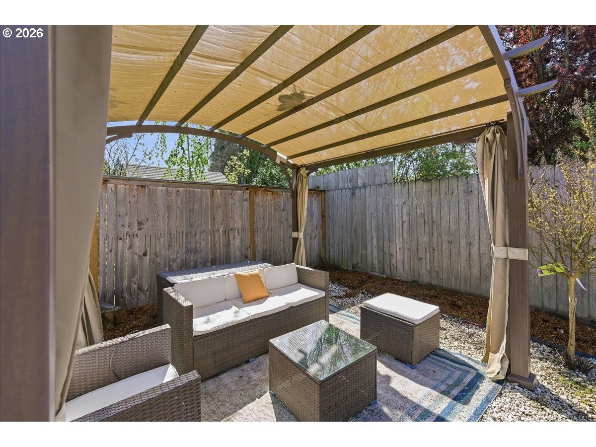 18988 Southwest Pike Lane Beaverton, OR 97078 - Photo 29 of 36 a backyard of a house with table and chairs