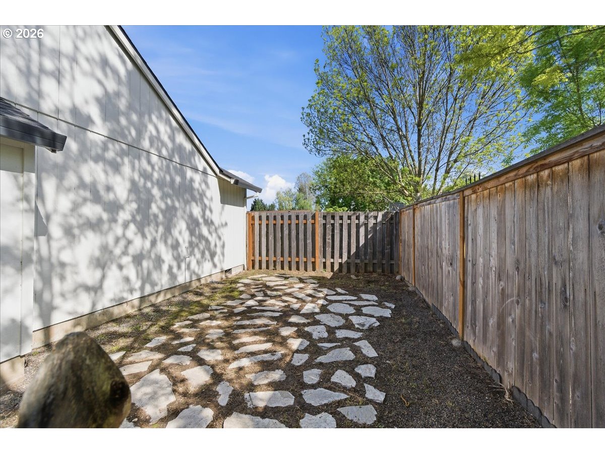 18988 Southwest Pike Lane Beaverton, OR 97078 - Photo 30 of 36 a view of outdoor space with wooden fence