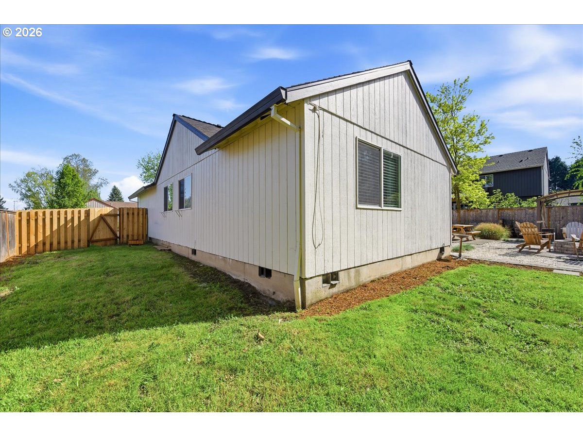 18988 Southwest Pike Lane Beaverton, OR 97078 - Photo 32 of 36 a backyard of a house with table and chairs