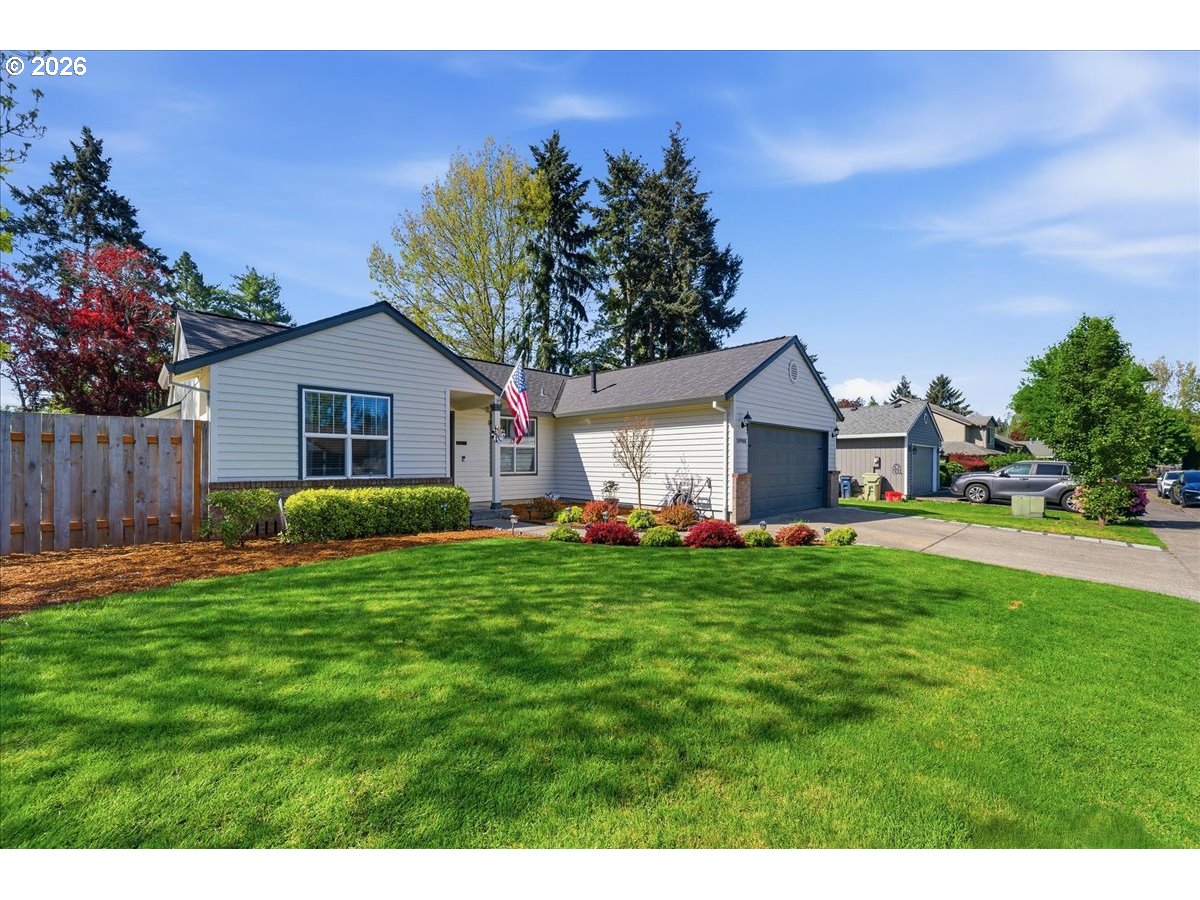 18988 Southwest Pike Lane Beaverton, OR 97078 - Photo 34 of 36 a front view of a house with a yard and garage