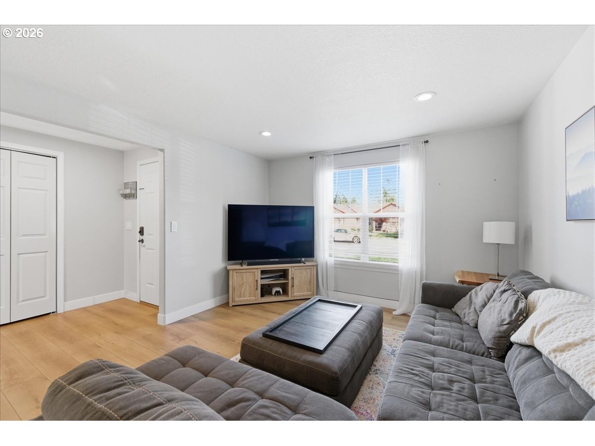 18988 Southwest Pike Lane Beaverton, OR 97078 - Photo 7 of 36 a living room with furniture and a flat screen tv