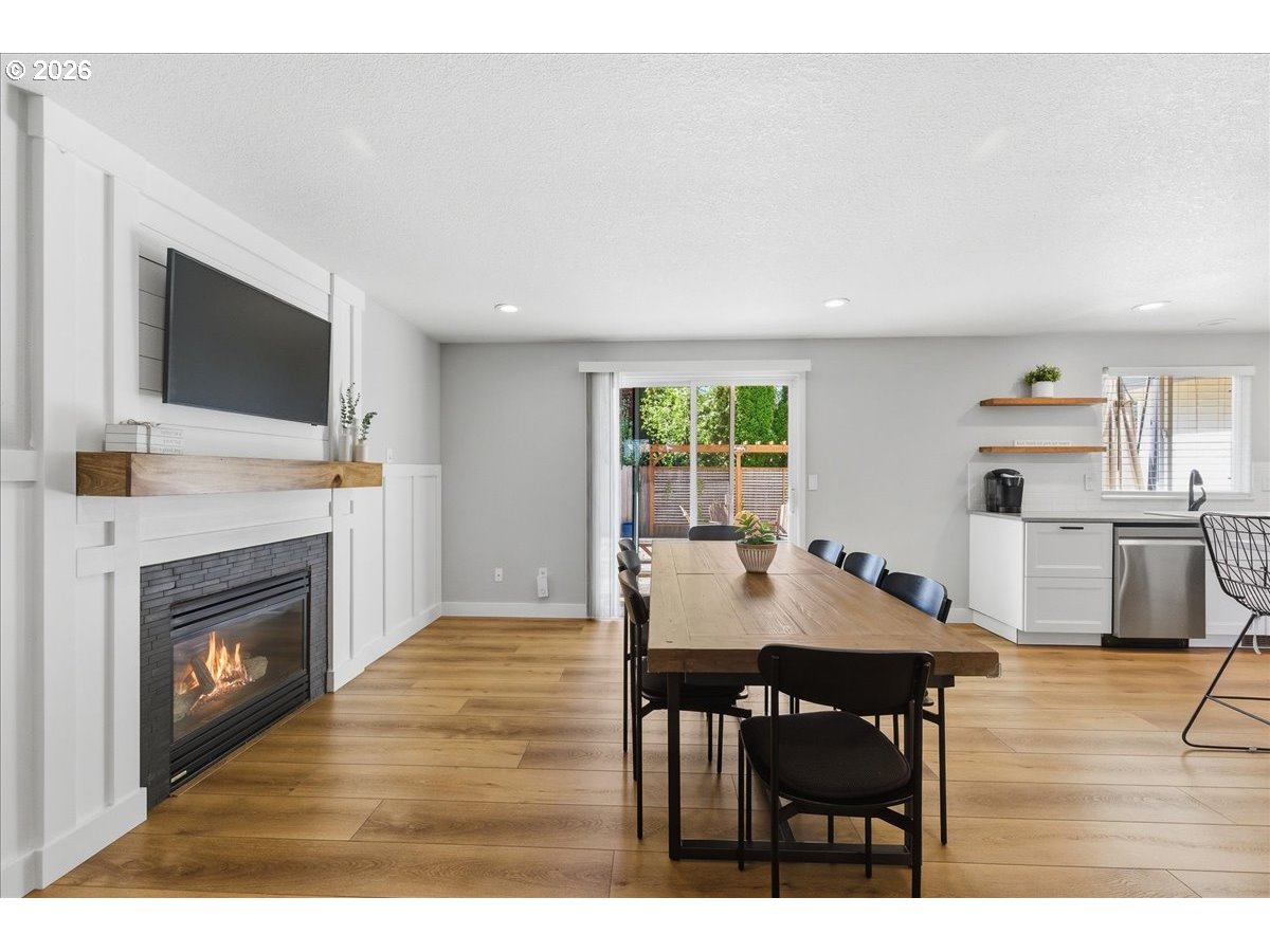 18988 Southwest Pike Lane Beaverton, OR 97078 - Photo 9 of 36 a view of a dining room with furniture and wooden floor