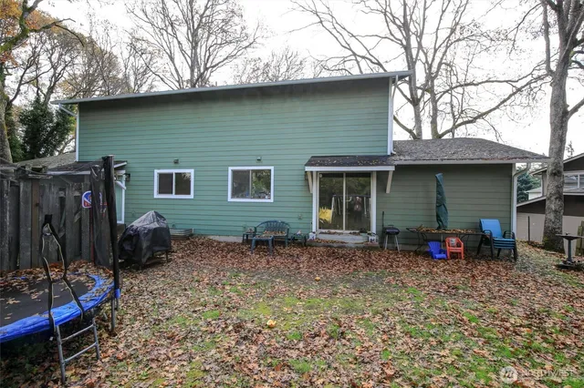 a backyard of a house with seating space