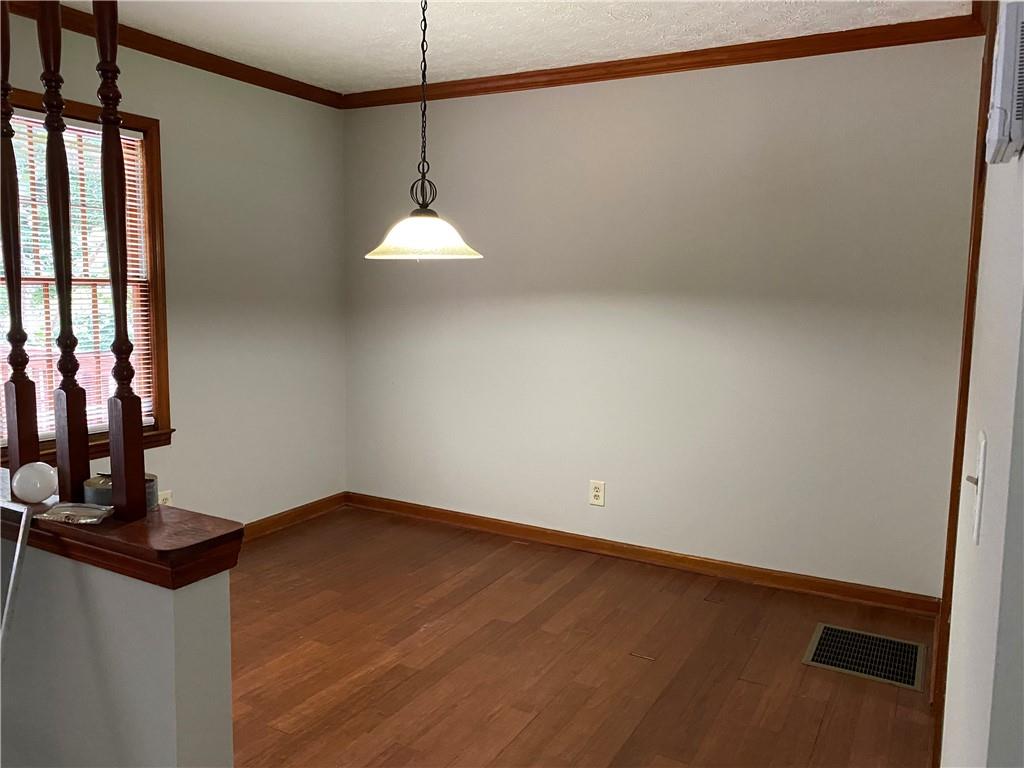 207 Hood Road Northwest Lilburn, GA 30047 - Photo 5 of 12 a view of an empty room with a window