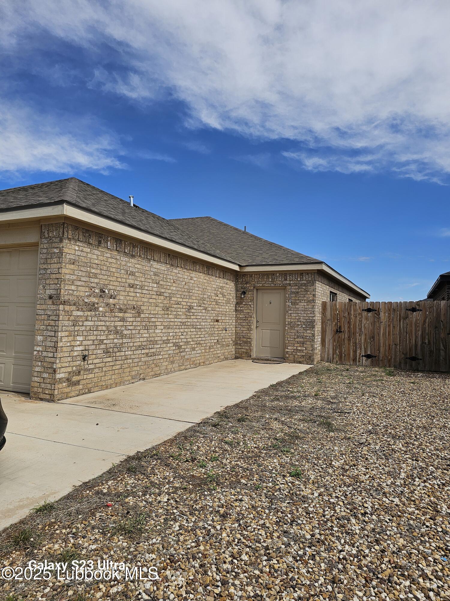 5524 Itasca Street, Unit A Lubbock, TX 79416 - Photo 1 of 1 a front view of a house with a yard