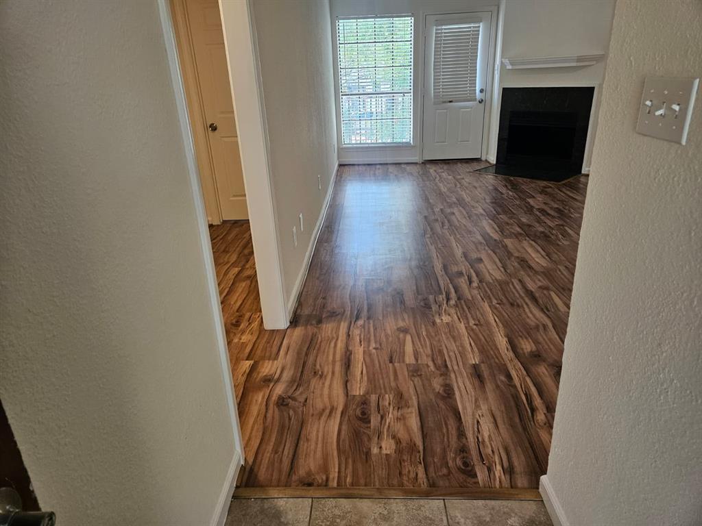9601 Forest Lane, Unit 224 Dallas, TX 75243 - Photo 17 of 17 wooden floor in a hall with wooden floor