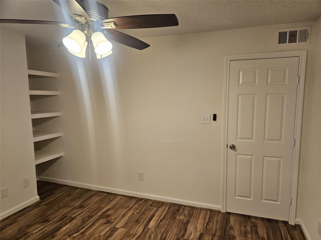 9601 Forest Lane, Unit 224 Dallas, TX 75243 - Photo 9 of 17 wooden floor in an empty room