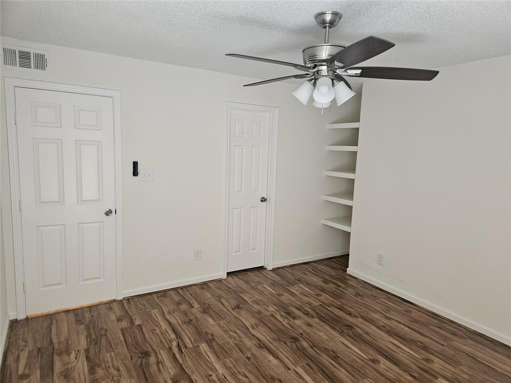 9601 Forest Lane, Unit 224 Dallas, TX 75243 - Photo 10 of 17 a view of a room with wooden floor and staircase