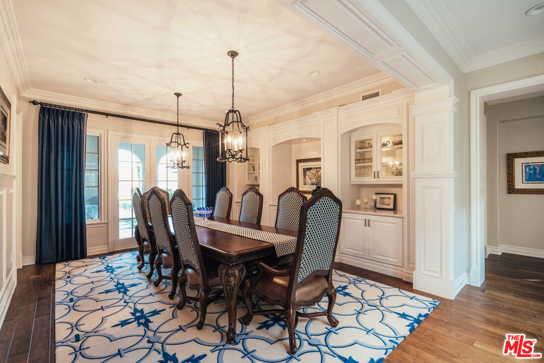 25311 Prado De Ambar Calabasas, CA 91302 - Photo 15 of 58 a view of a dining room with furniture window and wooden floor
