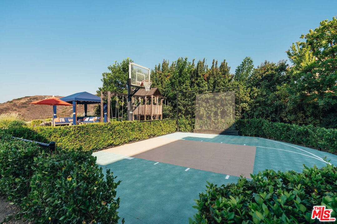 25311 Prado De Ambar Calabasas, CA 91302 - Photo 18 of 58 a view of a house with a yard and potted plants