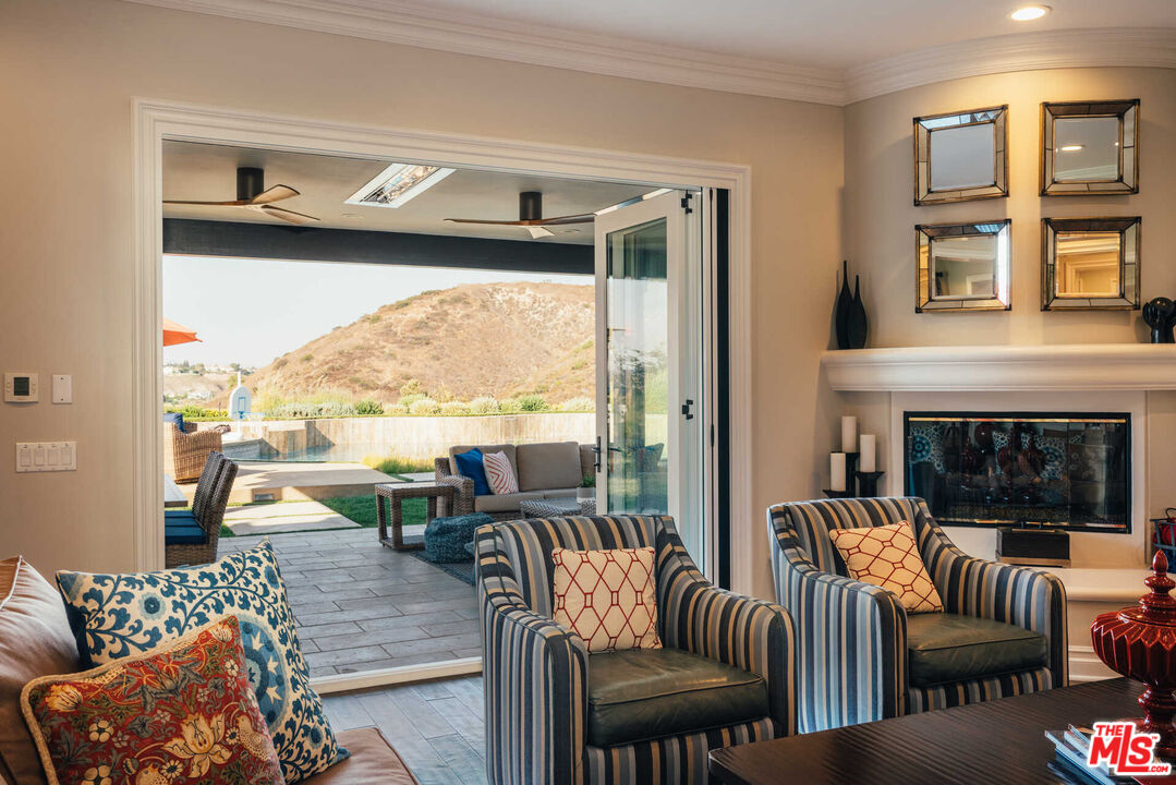 25311 Prado De Ambar Calabasas, CA 91302 - Photo 20 of 58 a living room with furniture and a large window