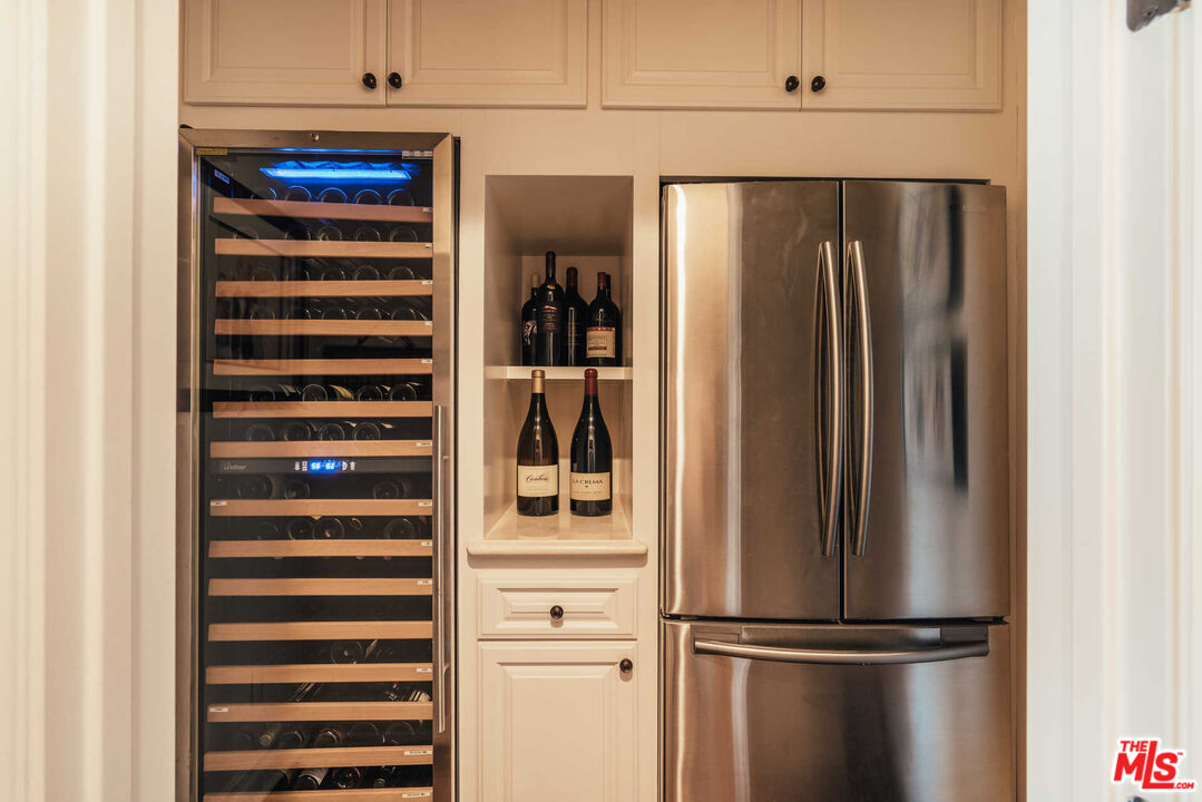 25311 Prado De Ambar Calabasas, CA 91302 - Photo 23 of 58 a view of a refrigerator in kitchen and an empty room