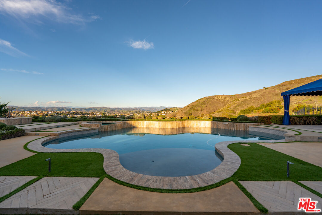 25311 Prado De Ambar Calabasas, CA 91302 - Photo 3 of 58 a view of a swimming pool with an ocean view