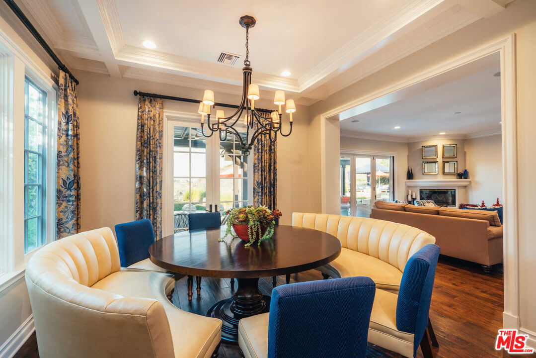 25311 Prado De Ambar Calabasas, CA 91302 - Photo 34 of 58 a view of a dining room with furniture wooden floor and chandelier