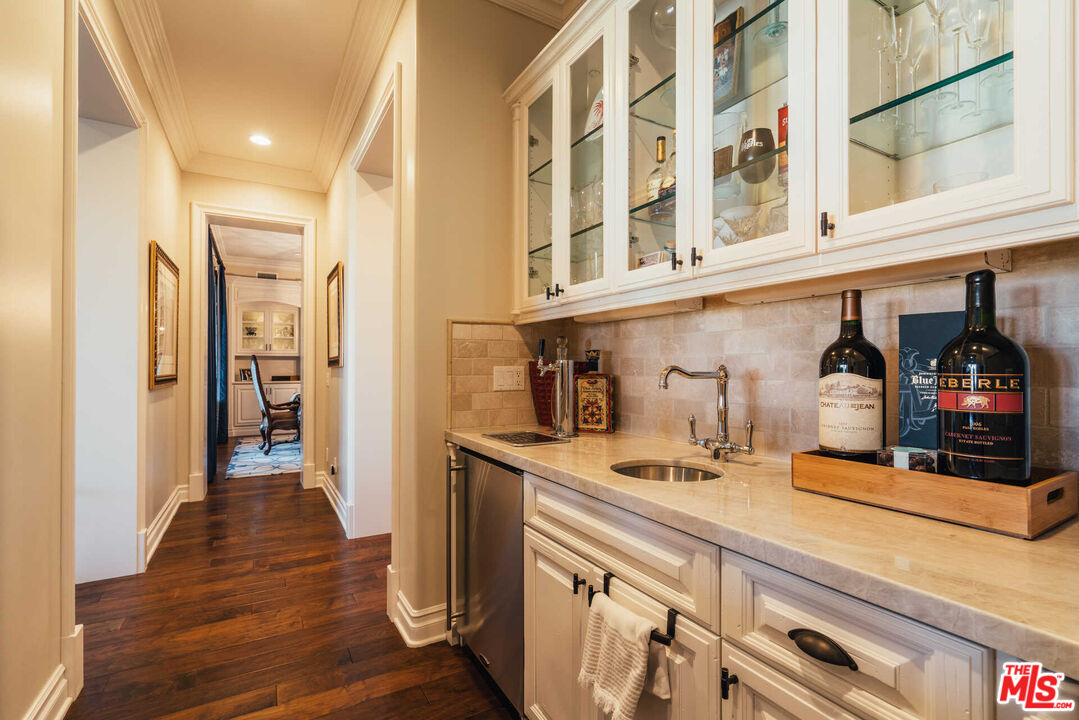 25311 Prado De Ambar Calabasas, CA 91302 - Photo 35 of 58 a kitchen with stainless steel appliances granite countertop a sink and cabinets