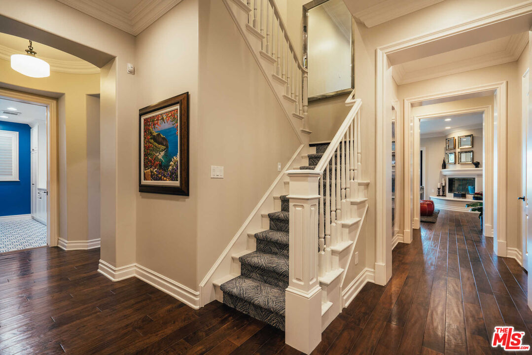 25311 Prado De Ambar Calabasas, CA 91302 - Photo 37 of 58 a view of entryway with wooden floor and stairs