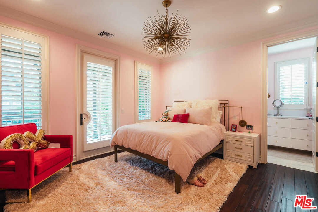 25311 Prado De Ambar Calabasas, CA 91302 - Photo 38 of 58 a bedroom with a bed and a couch