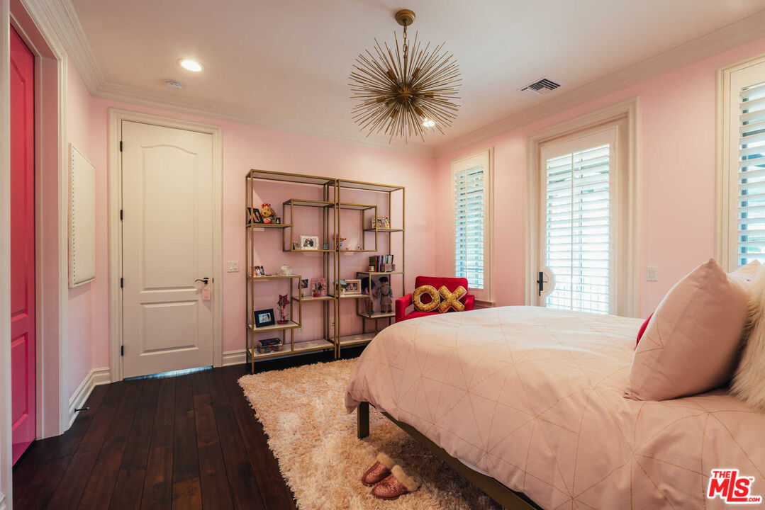 25311 Prado De Ambar Calabasas, CA 91302 - Photo 39 of 58 a bedroom with a large bed and a tv