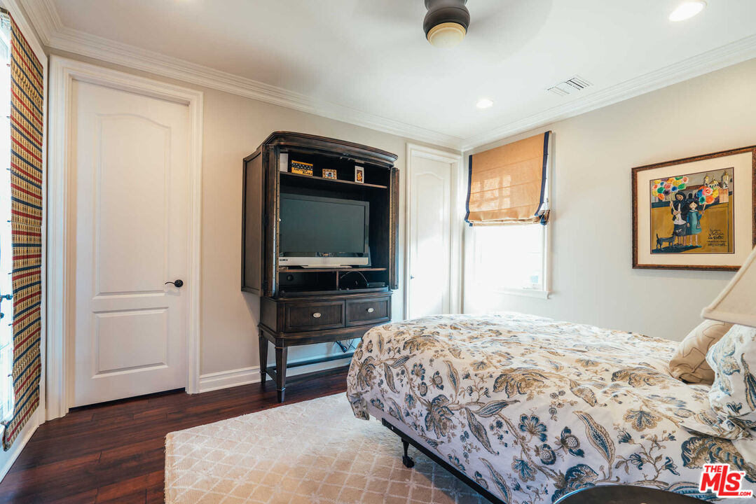 25311 Prado De Ambar Calabasas, CA 91302 - Photo 44 of 58 a bedroom with a bed and a flat screen tv