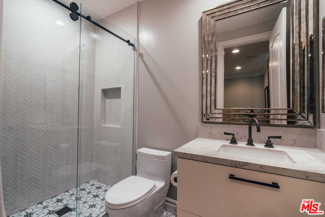 25311 Prado De Ambar Calabasas, CA 91302 - Photo 45 of 58 a bathroom with a sink a toilet and shower