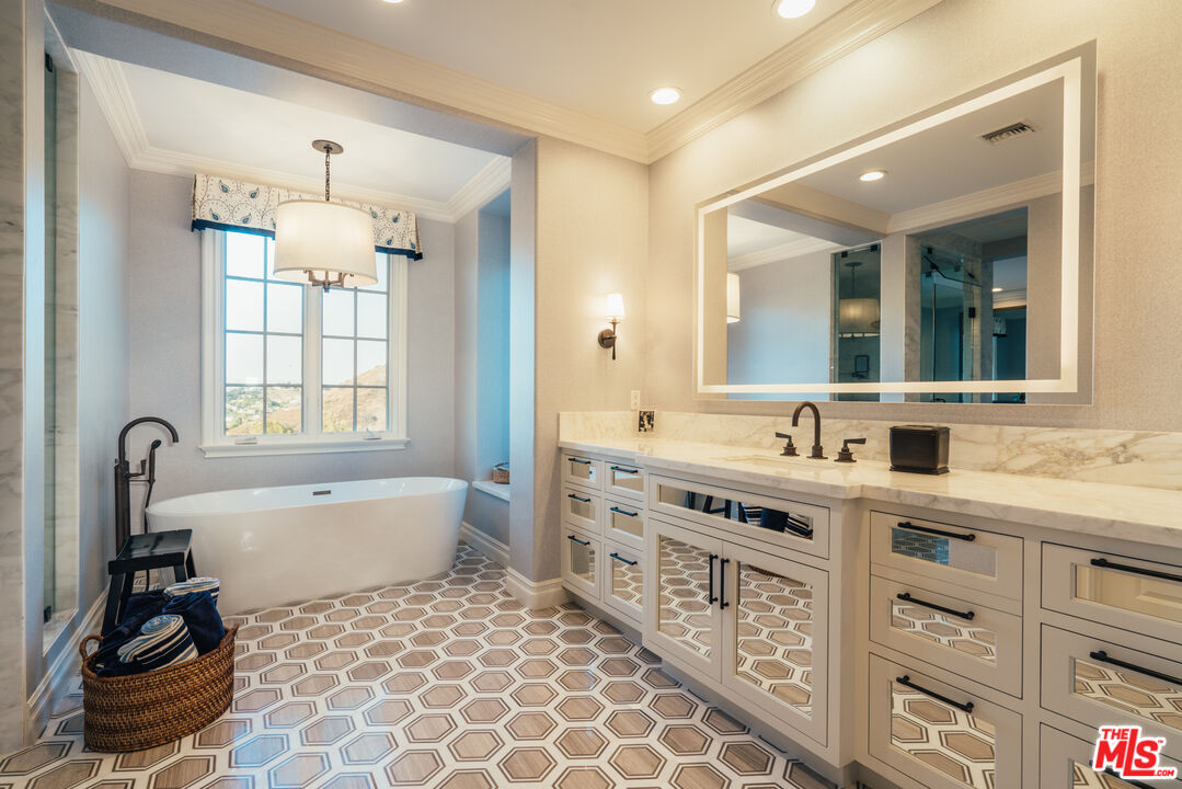 25311 Prado De Ambar Calabasas, CA 91302 - Photo 49 of 58 a bathroom with a double vanity sink mirror and bathtub