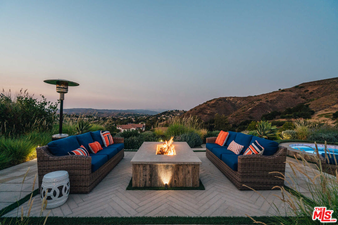 25311 Prado De Ambar Calabasas, CA 91302 - Photo 53 of 58 a outdoor space with patio couch and a fire pit