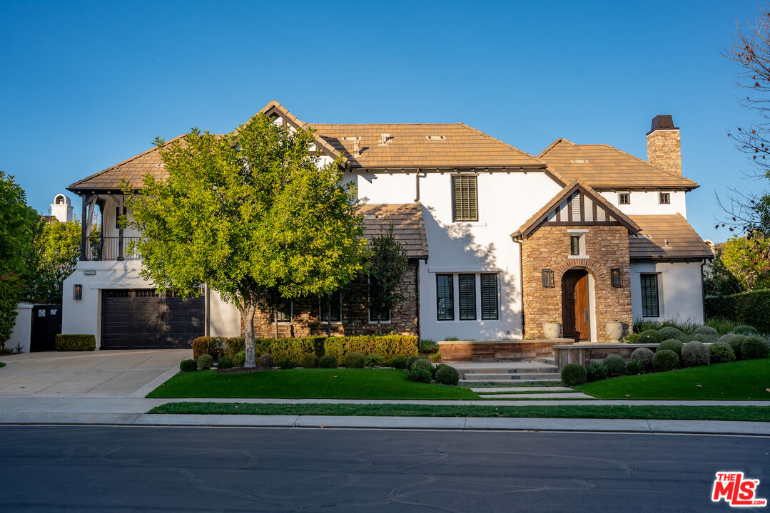 25311 Prado De Ambar Calabasas, CA 91302 - Photo 57 of 58 a front view of a house with a yard