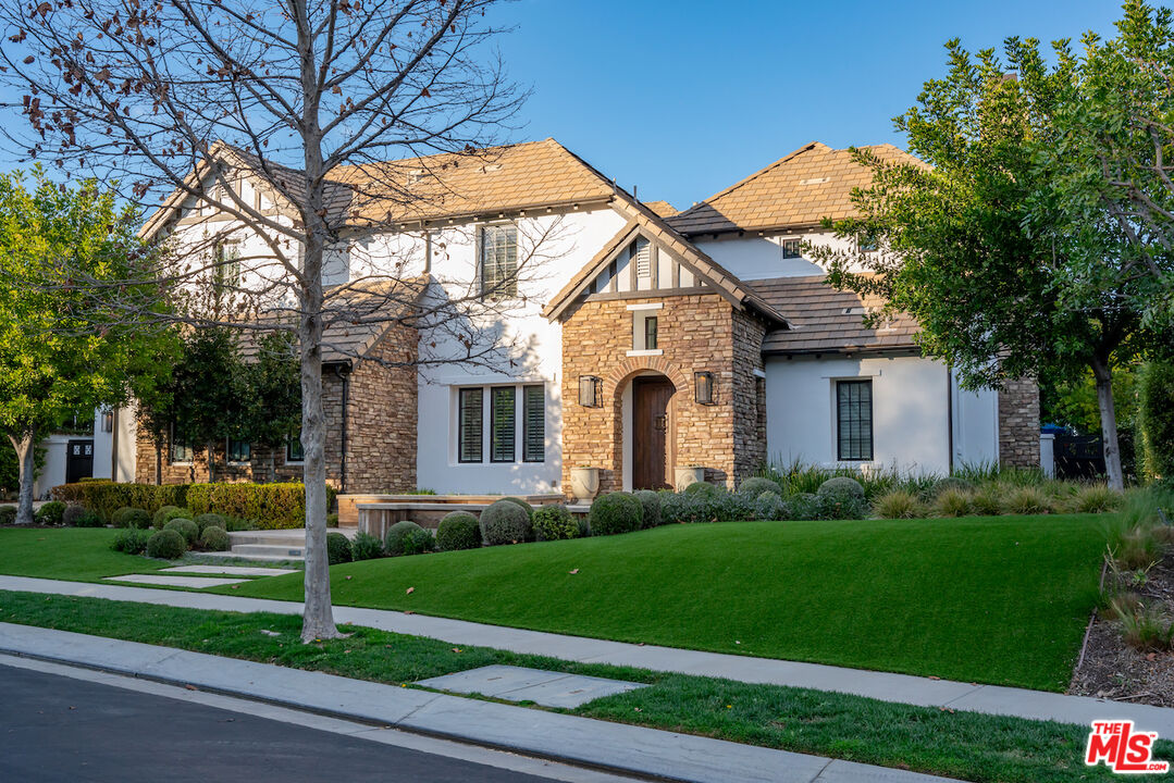 25311 Prado De Ambar Calabasas, CA 91302 - Photo 58 of 58 a front view of a house with a yard