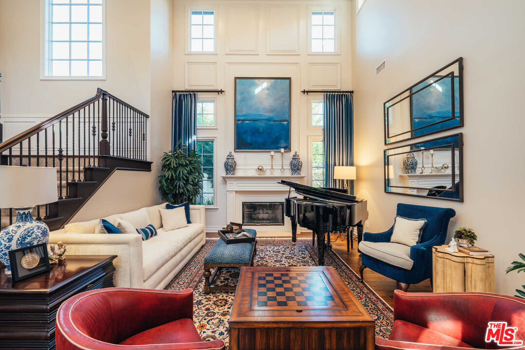 25311 Prado De Ambar Calabasas, CA 91302 - Photo 8 of 58 a living room with furniture fireplace and a window