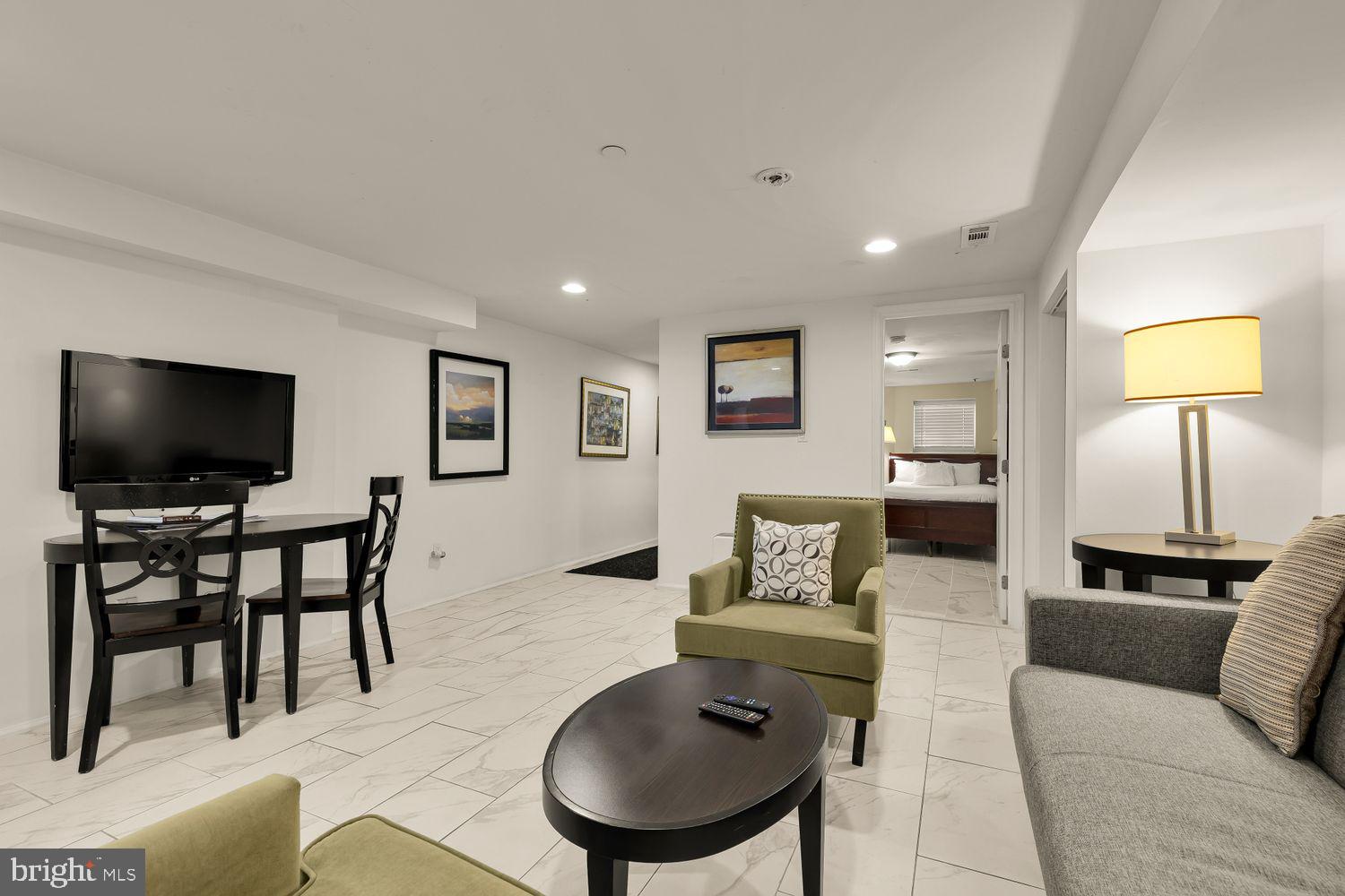 2814 13th Street Northwest Washington, DC 20009 - Photo 27 of 35 a living room with furniture and a flat screen tv